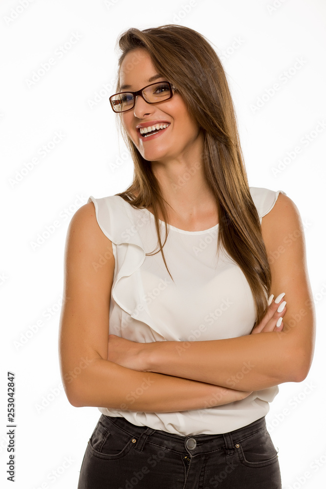 Portrait of young beautiful woman with crossed arms on white background Portrait of young beautiful woman with crossed arms on white background
