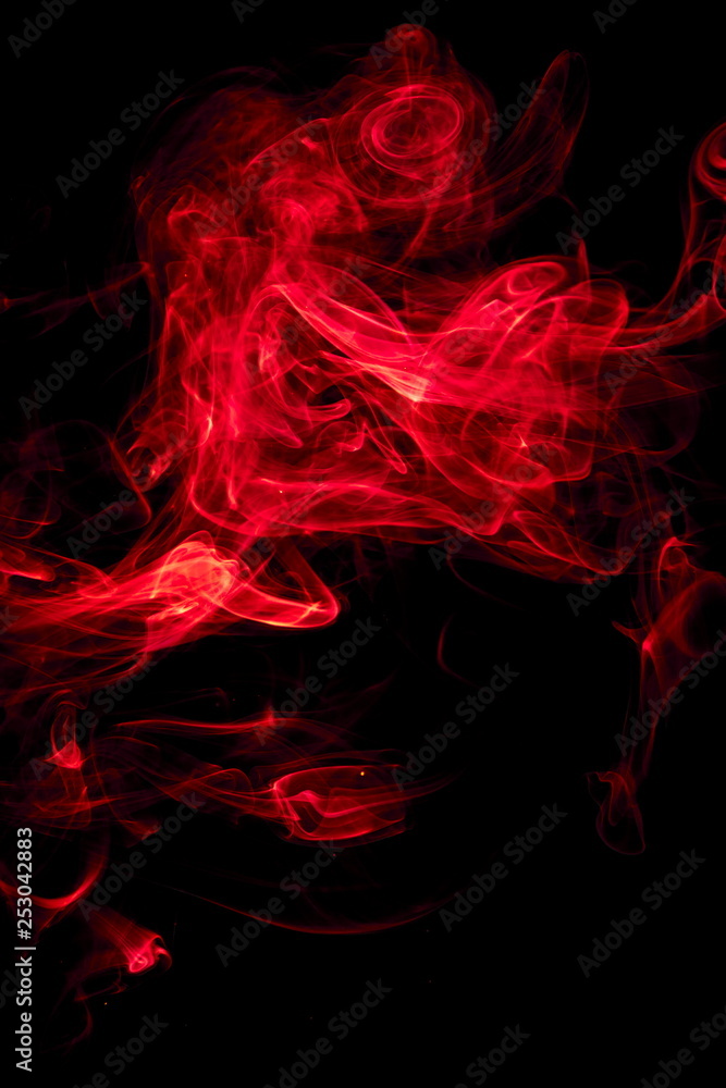 Fototapeta premium Red smoke on black background