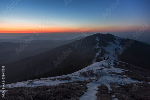 Morning gradient shades on the Carpathian mountains.Twilight in the Carpathian Mountains. Blazing sky and blue mountain ranges