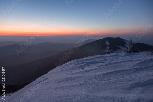 Morning gradient shades on the Carpathian mountains.Twilight in the Carpathian Mountains. Blazing sky and blue mountain ranges © ihorhvozdetskiy