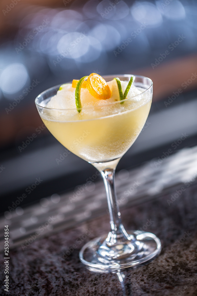 Cocktail drink frozen margarita at barcounter in night club or restaurant Cocktail drink frozen margarita at barcounter in night club or restaurant