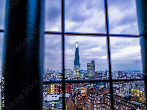 London Skyline through Fence © Ali