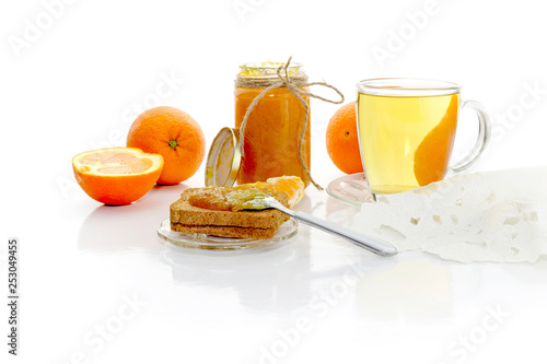 The orange jam on rusks and tea