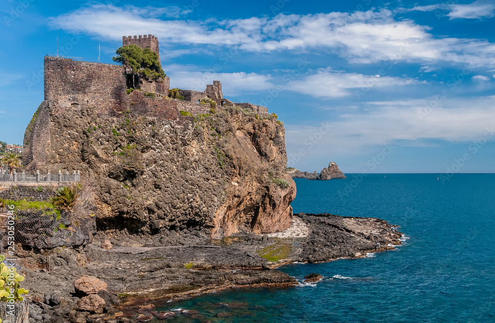Beautiful view of Aci Castello overlooking the sea on a beautiful sunny day, Catania, Sicily, Italy