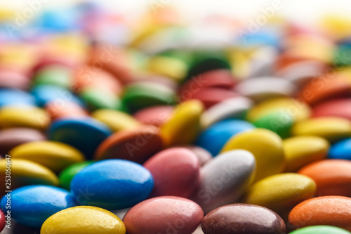colored round candy scattered on the table close-up