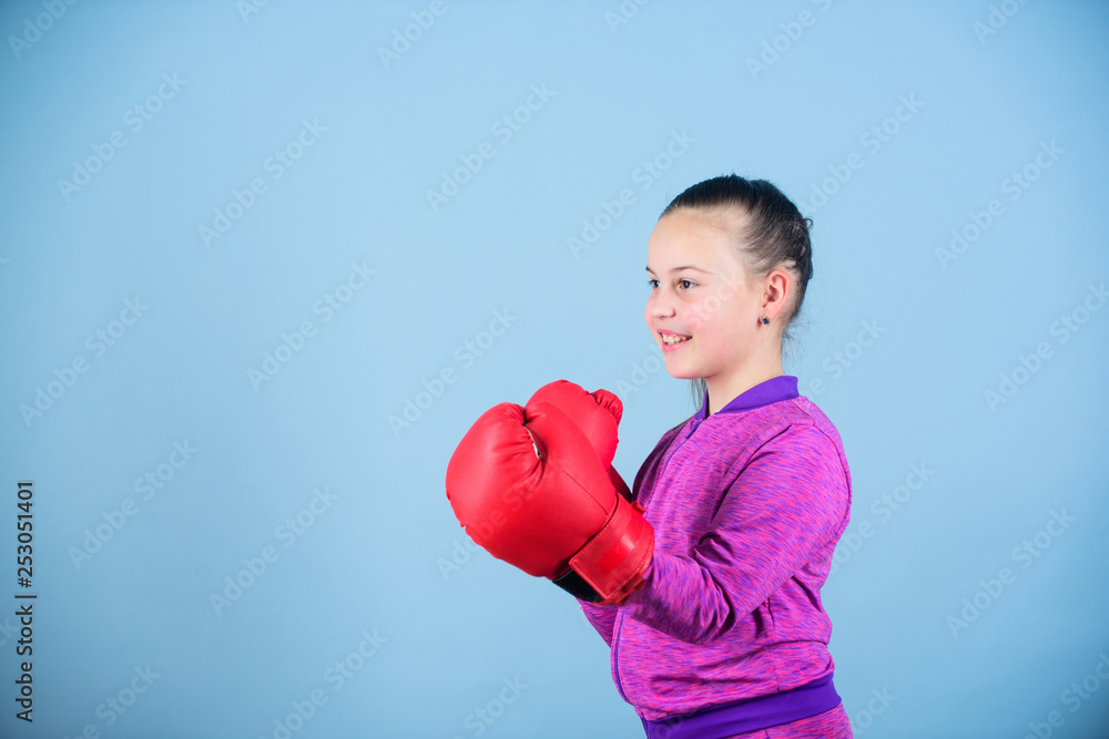 workout of small girl boxer. Sport success. sportswear fashion. Fitness diet. energy health. Happy child sportsman in boxing gloves. punching knockout. Childhood activity. Sporty beauty workout of small girl boxer. Sport success. sportswear fashion. Fitness diet. energy health. Happy child sportsman in boxing gloves. punching knockout. Childhood activity. Sporty beauty