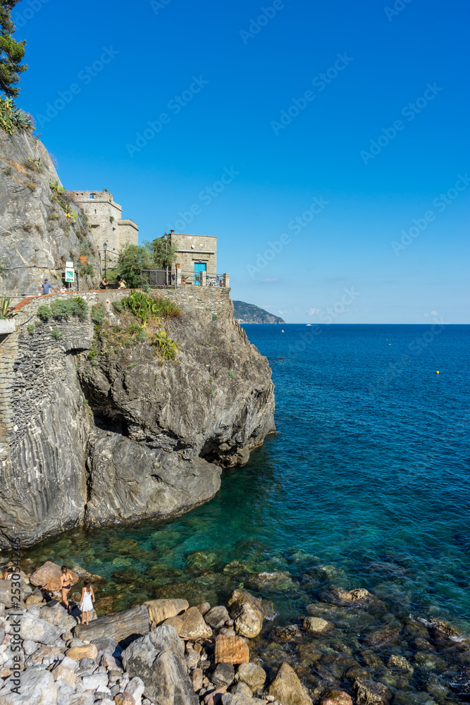Italy, Cinque Terre, Monterosso, a close up of a rock near the ocean