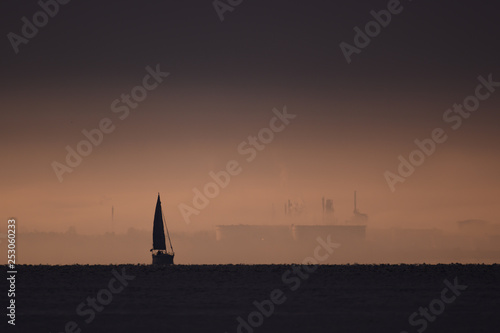 Sailboat in industrial environment  photo