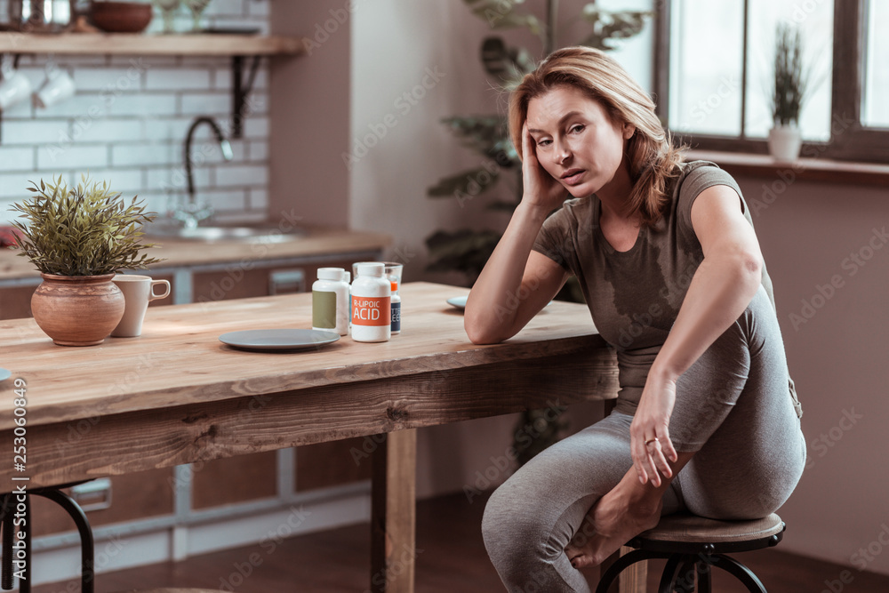 Depressed and stressed mature woman looking unhealthy Depressed and stressed mature woman looking unhealthy