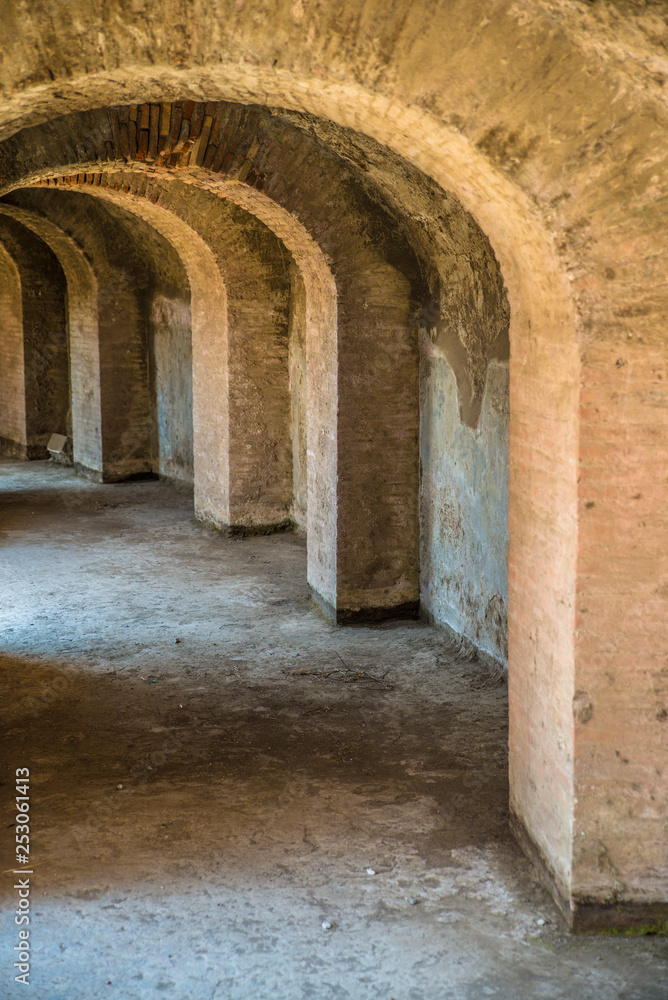 POMPEII, ITALY - 8 August 2015: Ruins of antique roman temple in Pompeii near volcano Vesuvius, Naples, Italy