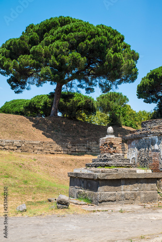 POMPEII, ITALY - 8 August 2015: Ruins of antique roman temple in Pompeii near volcano Vesuvius, Naples, Italy