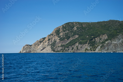 Italy, Cinque Terre, Monterosso, Monterosso al Mare, SCENIC VIEW OF SEA AGAINST CLEAR BLUE SKY © SkandaRamana