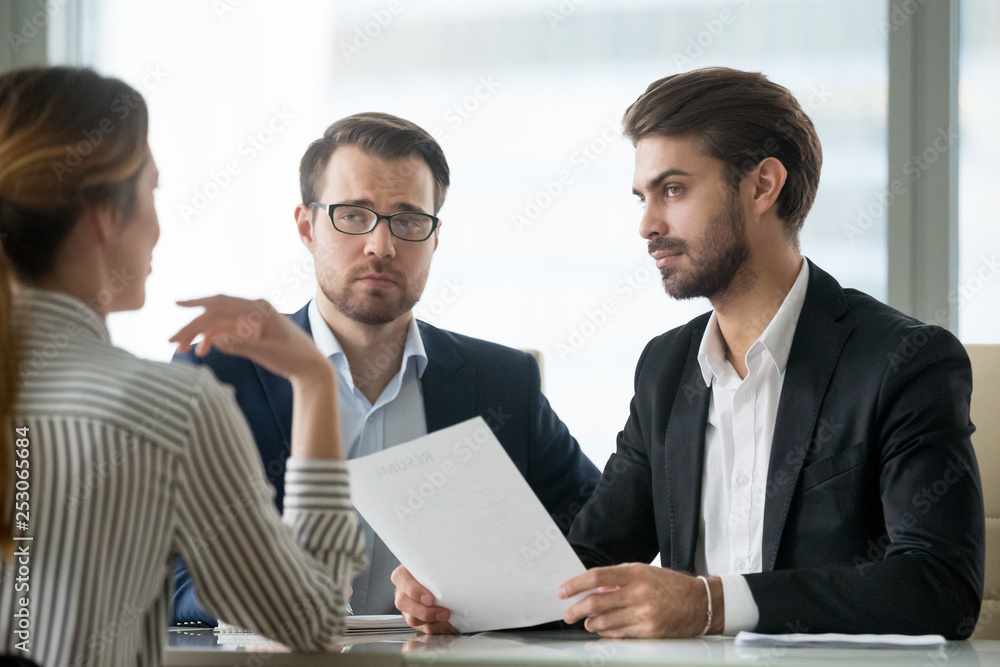 Skeptical male hr managers unconvinced about hiring female candidate Skeptical male hr managers unconvinced about hiring female candidate