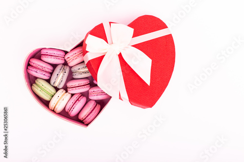 Macaroons cookies on a heart box isolation on a white background