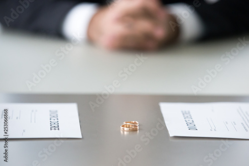 Photography Close up view of decree paper and rings on table