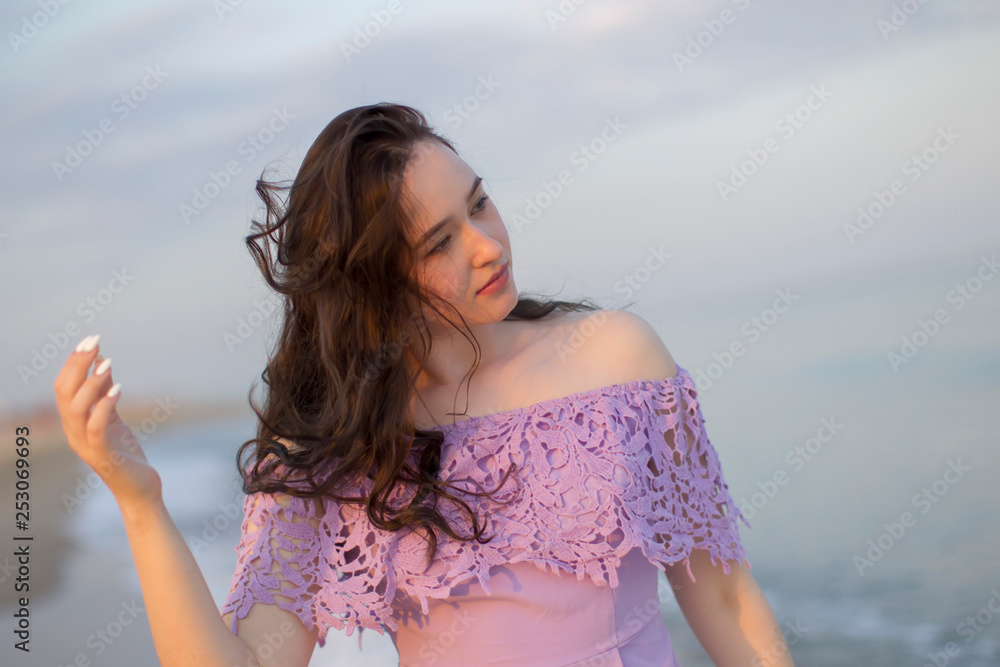 Young ordinary girl against the sky and sea Young ordinary girl against the sky and sea
