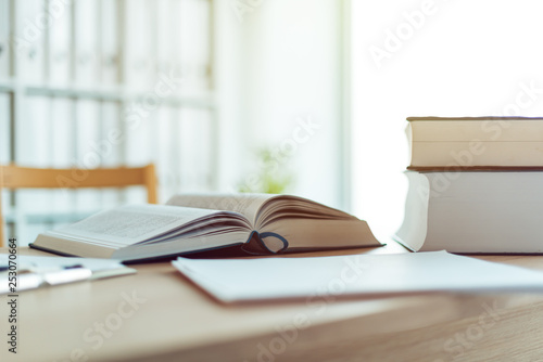 Open book on desk in law firm office photo