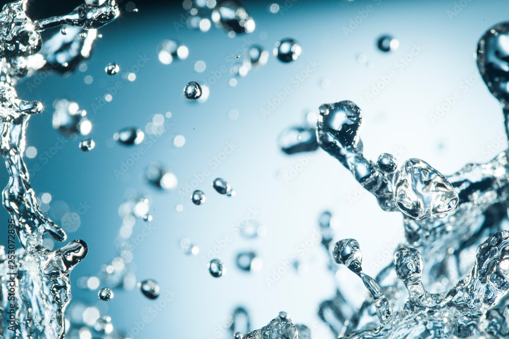Abstract Splash of Water on a Blue Background Abstract Splash of Water on a Blue Background
