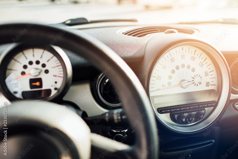 Modern car Interior - steering wheel, shift lever and dashboard.