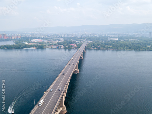 Russia, Krasnoyarsk. Aerial view of the Communal Bridge over the Yenisei River photo