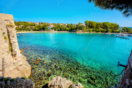 Fototapeta Naklejka Na Ścianę i Meble -   Turquoise small bay and beach in Krk, main town at Krk island, Croatia