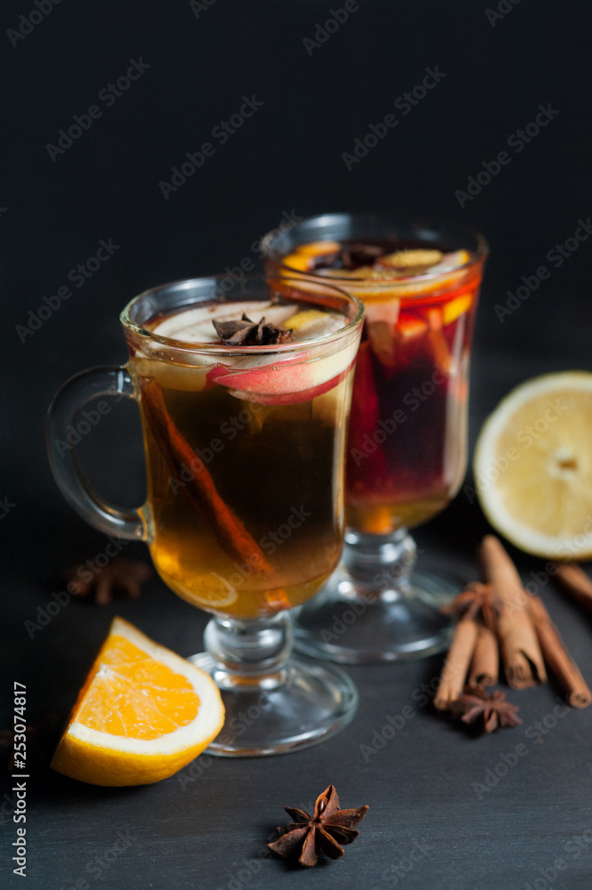 Mulled wine in white rustic mugs with spices and citrus fruit Mulled wine in white rustic mugs with spices and citrus fruit