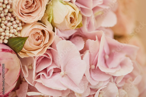 Fototapeta Naklejka Na Ścianę i Meble -  close up of bouquet of roses and pink peonies on table