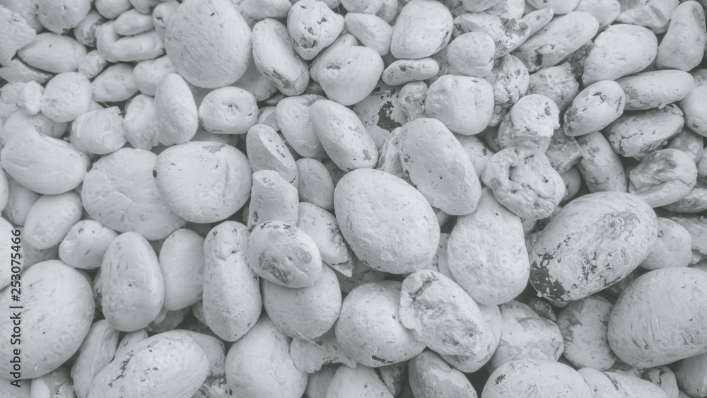 Naklejka White pebbles background, There are a lot of white gravel. Ideas for the background., pebbles on the beach