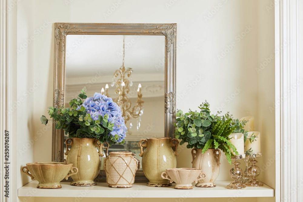 mirror, beige set with and flowers on shelf