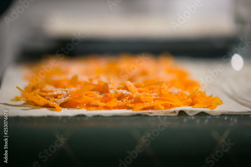 Preparation of pumpkin and apple pie with phyllo crust.