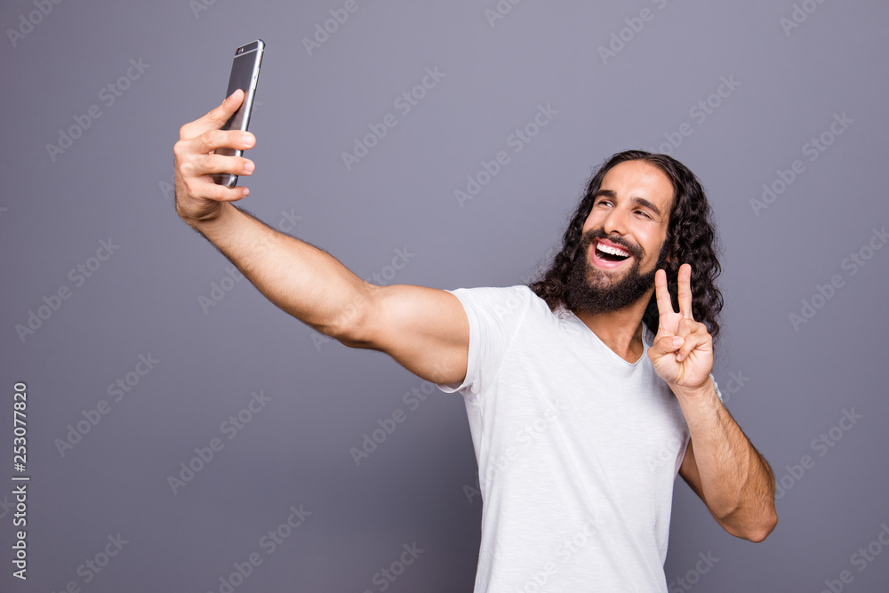Portrait of his he nice groomed attractive cheerful cheery optimistic wavy-haired guy take make selfie device gadget showing v-sign isolated over gray violet purple pastel background Portrait of his he nice groomed attractive cheerful cheery optimistic wavy-haired guy take make selfie device gadget showing v-sign isolated over gray violet purple pastel background
