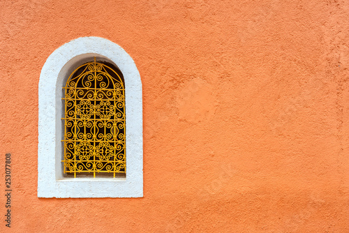Obraz na płótnie Typical window with decorative grille on colour wall. Marrakech, Morocco w salonie