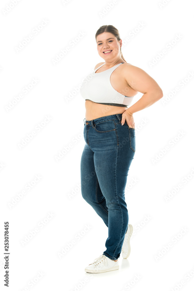 happy smiling overweight woman in jeans posing with hand in pocket isolated on white, body positivity concept happy smiling overweight woman in jeans posing with hand in pocket isolated on white, body positivity concept