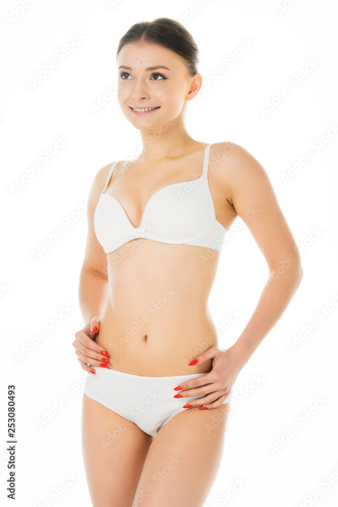 attractive smiling girl in underwear with hands on hips isolated on white attractive smiling girl in underwear with hands on hips isolated on white