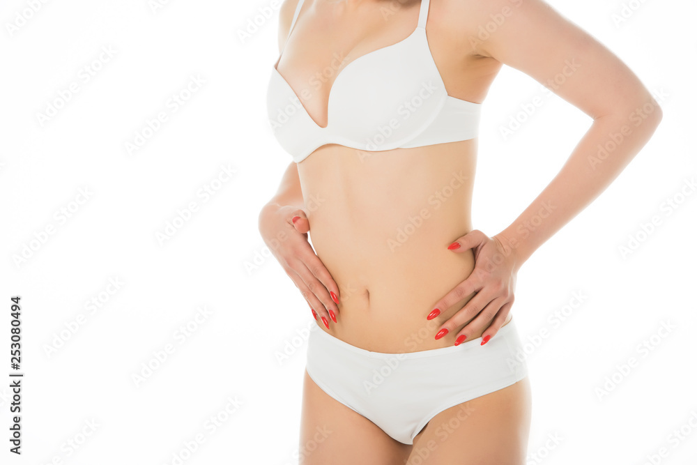 cropped view of attractive girl in underwear touching belly isolated on white