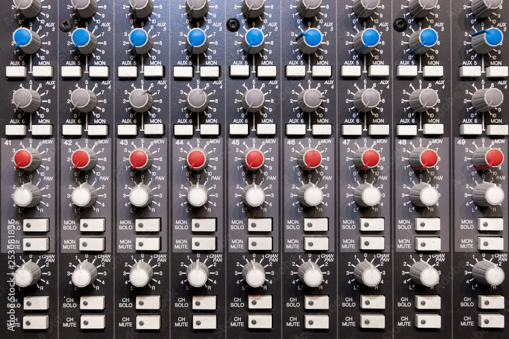 Abstract view of Professional audio mixing console with faders and adjusting knobs -Music / radio / TV broadcasting