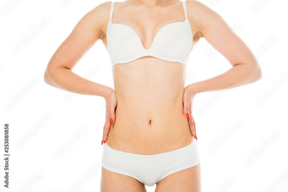 partial view of slim woman posing with hands on waist isolated on white partial view of slim woman posing with hands on waist isolated on white