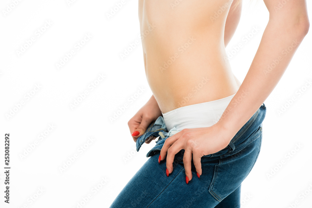 cropped view of slim woman in underwear taking off blue jeans isolated on  white Photos | Adobe Stock