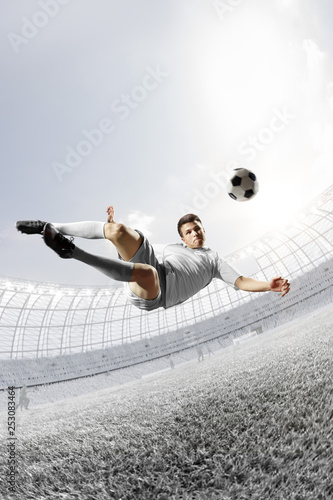 soccer player in action, stadium backgroun absolutely white style toning