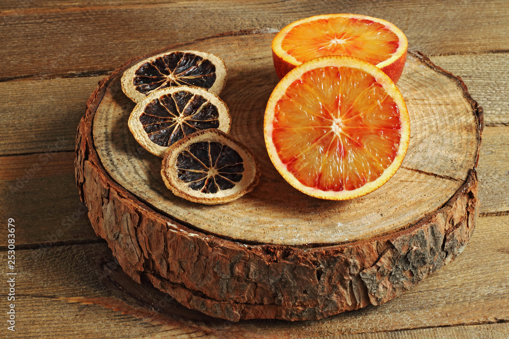 Juicy reddish tangerine on wood Juicy reddish tangerine on wood