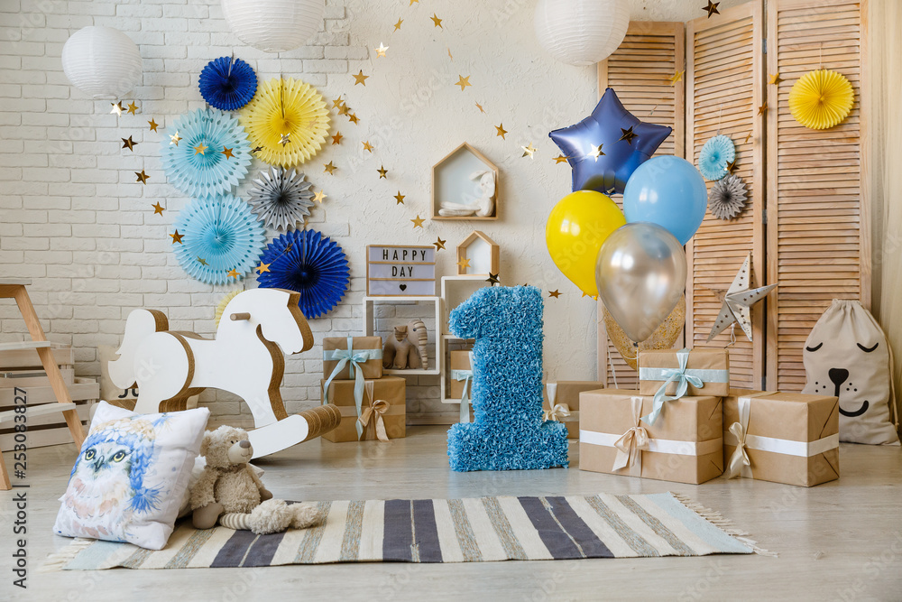 Birthday gold and silver decorations with gifts, toys, garlands and ...