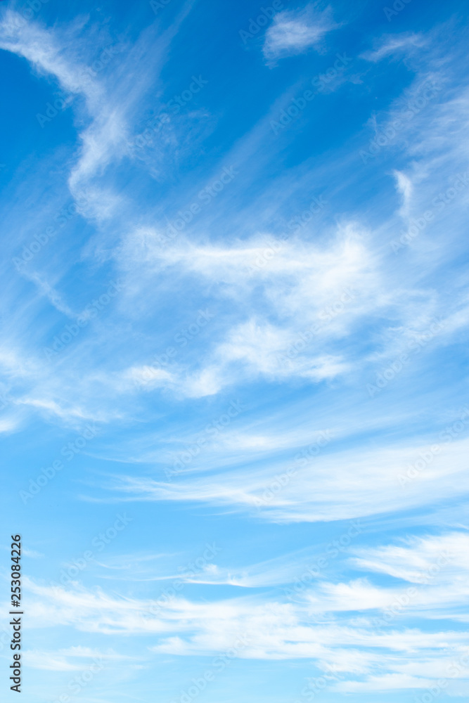 White clouds high in the sky at windy winter day background - obrazy, fototapety, plakaty 