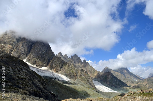 Glaciers on mountains and clouds landscape in the Kashmir Great Lakes trek which starts from Sonamarg to Naranag Village in Jammu & Kashmir, India. 