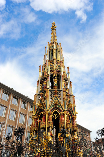 The painted fountain tower in the middle of Nuremberg market place in Germany.