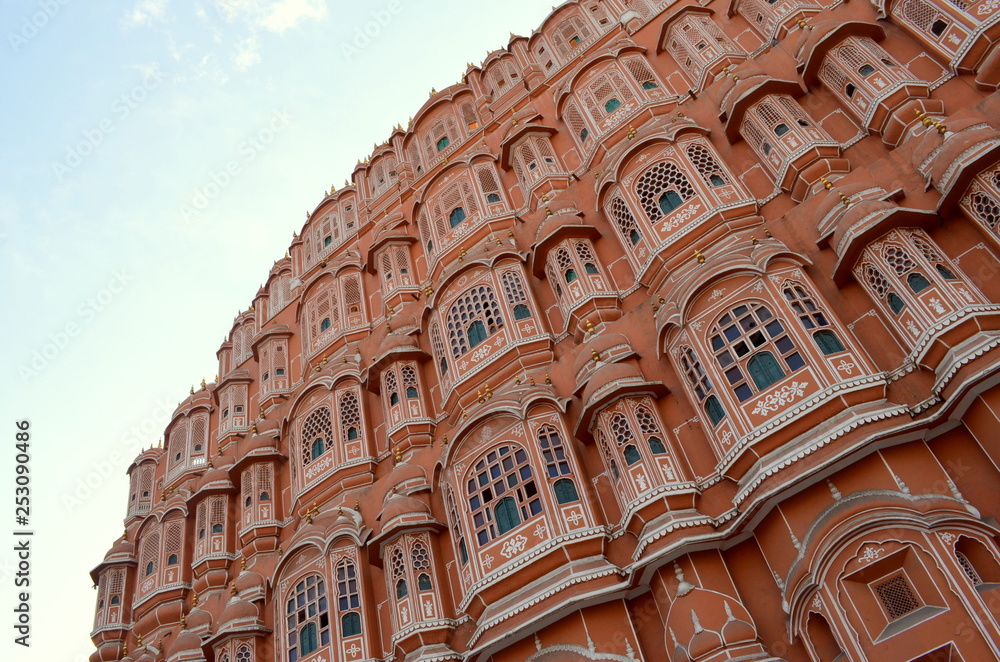 Low angle Establishing shot of Hawa Mahal. Hawa Mahal is constructed of red and pink sandstone. The structure was built in 1799 by Maharaja Sawai Pratap Singh  in Jaipur, Rajasthan, India.