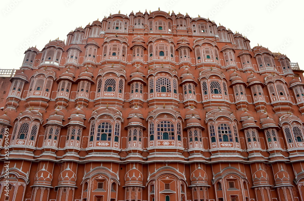 Low angle shot of facade of Hawa Mahal. Constructed with red and pink sandstone, the structure was built in 1799 by Maharaja Sawai Pratap Singh  in Jaipur, Rajasthan, India.