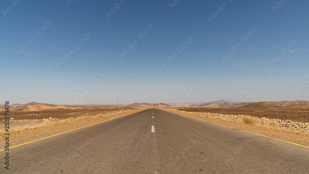 The journey to Danakil Depression is long but most of it is today paved. An empty road of Afar region in Ethiopia.