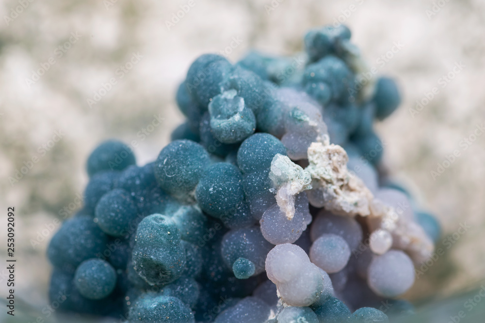 Fototapeta premium Grape Agate Clusters from Indonesia in Moss Agate hand carved polished bowl from Morocco. Botryoidal Purple Chalcedony.