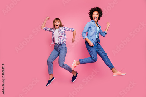 Full length body size view of two person nice cool careless carefree attractive charming cheerful funny girls having fun rejoicing weekend isolated over pink pastel background