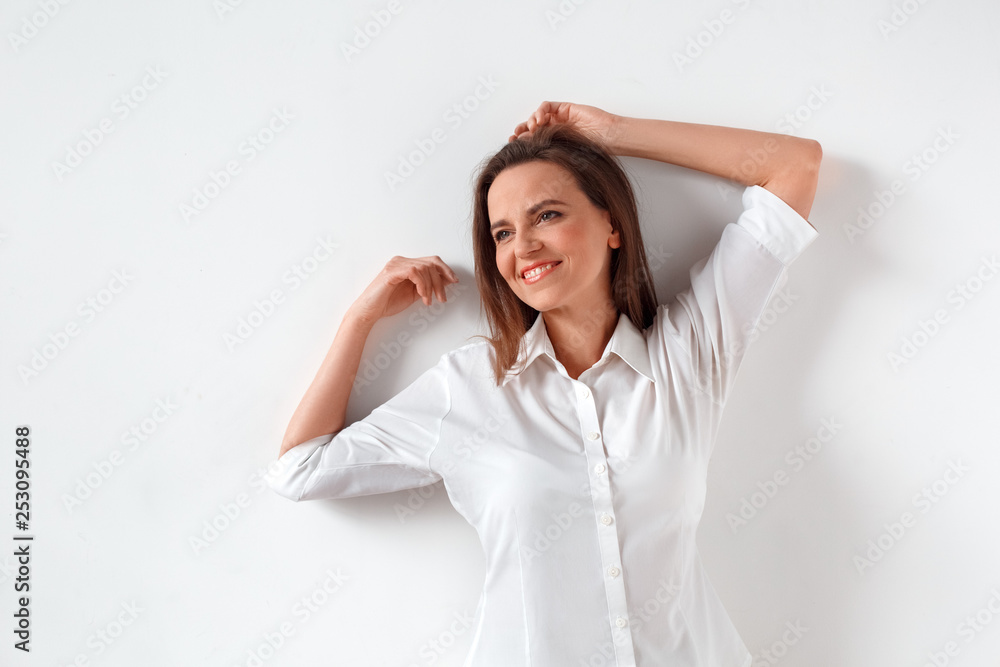 Freestyle. Woman standing isolated on white leaning back smiling relaxed Freestyle. Woman standing isolated on white leaning back smiling relaxed